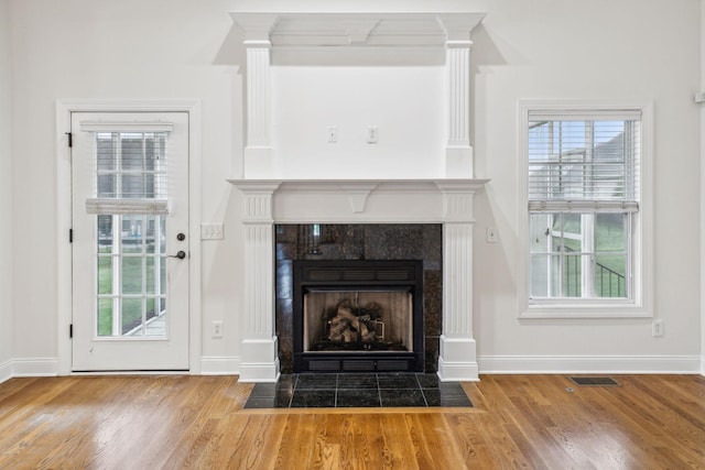 1015 Kingman Ave, Murfreesboro, TN 37129 - unfurnished living room with a fireplace, wood finished floors, and baseboards
