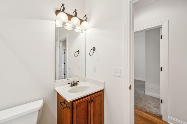 1015 Kingman Ave, Murfreesboro, TN 37129 - bathroom featuring toilet, vanity, wood finished floors, and baseboards