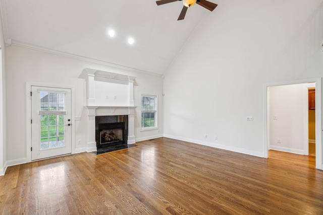 1015 Kingman Ave, Murfreesboro, TN 37129 - unfurnished living room with ornamental molding, high vaulted ceiling, ceiling fan, a tile fireplace, and wood finished floors