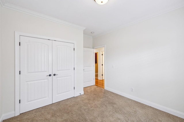1015 Kingman Ave, Murfreesboro, TN 37129 - unfurnished bedroom featuring carpet, crown molding, a closet, and baseboards