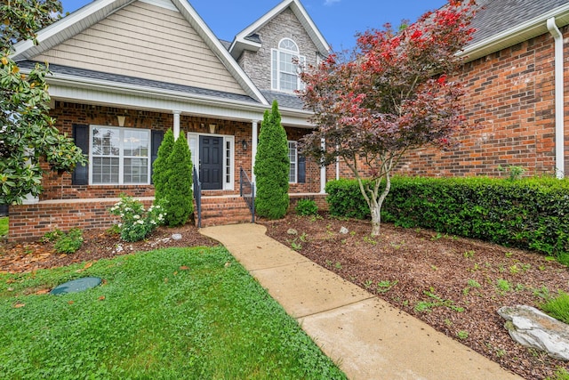 1015 Kingman Ave, Murfreesboro, TN 37129 - view of front of house featuring roof with shingles, brick siding, and a front lawn