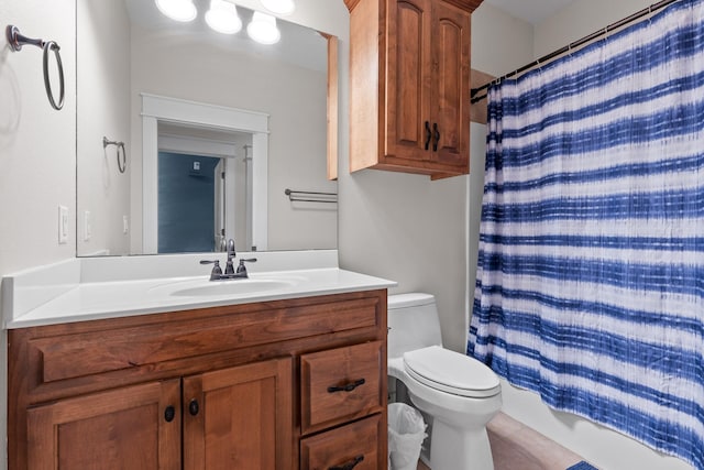 full bath with toilet, a shower with curtain, and vanity