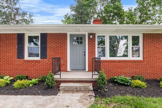 2851 Cooper Creek Rd, Woodlawn, TN 37191 - entrance to property with brick siding and a chimney
