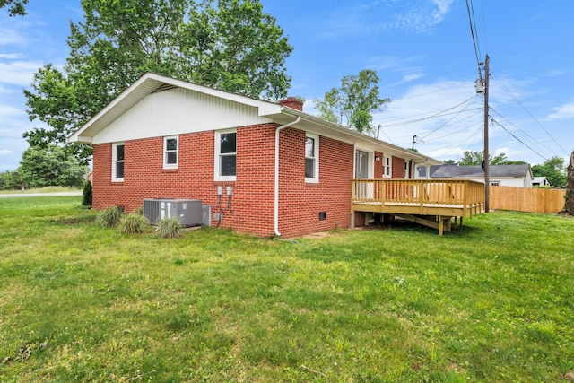 2851 Cooper Creek Rd, Woodlawn, TN 37191 - rear view of property with central air condition unit, brick siding, a deck, and a chimney