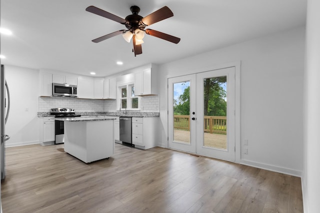 2851 Cooper Creek Rd, Woodlawn, TN 37191 - kitchen featuring stainless steel appliances, backsplash, white cabinets, and recessed lighting