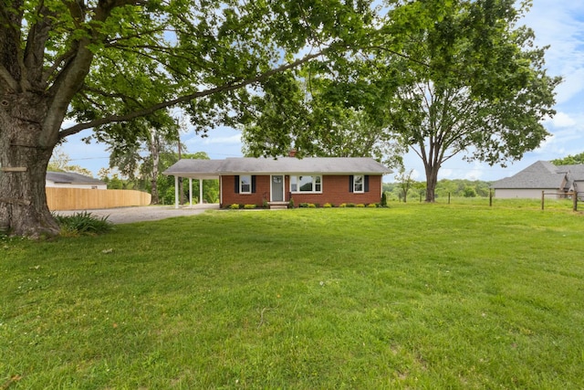 2851 Cooper Creek Rd, Woodlawn, TN 37191 - single story home with driveway, a carport, and brick siding