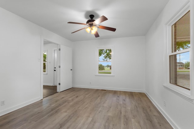 2851 Cooper Creek Rd, Woodlawn, TN 37191 - spare room featuring plenty of natural light, light wood-style floors, ceiling fan, and baseboards
