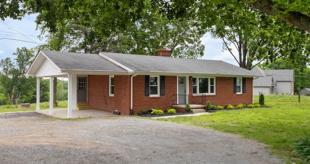 2851 Cooper Creek Rd, Woodlawn, TN 37191 - ranch-style house featuring dirt driveway, a chimney, brick siding, a front yard, and a shingled roof