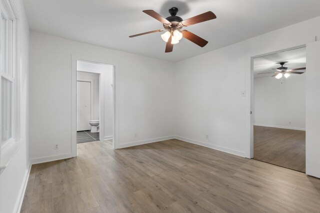 2851 Cooper Creek Rd, Woodlawn, TN 37191 - spare room with a ceiling fan, wood finished floors, and baseboards