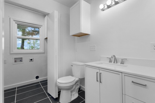 2851 Cooper Creek Rd, Woodlawn, TN 37191 - bathroom featuring toilet, vanity, tile patterned flooring, and baseboards