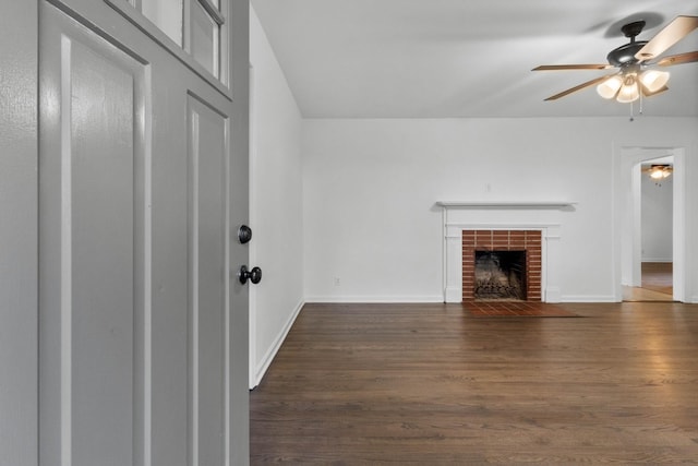 2851 Cooper Creek Rd, Woodlawn, TN 37191 - unfurnished living room with a ceiling fan, a brick fireplace, dark wood-style flooring, and baseboards