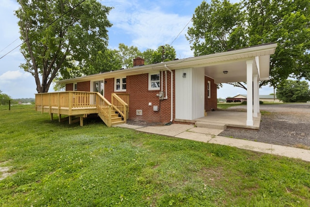 2851 Cooper Creek Rd, Woodlawn, TN 37191 - back of property with a chimney, brick siding, a yard, and a deck