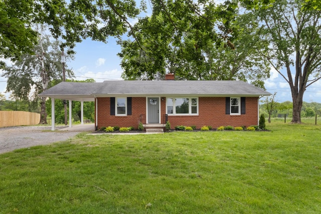 2851 Cooper Creek Rd, Woodlawn, TN 37191 - ranch-style house with gravel driveway, brick siding, a carport, and a front lawn