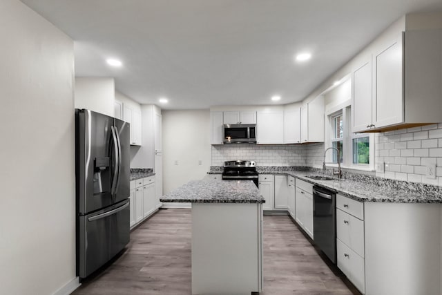 2851 Cooper Creek Rd, Woodlawn, TN 37191 - kitchen featuring stainless steel appliances, a sink, tasteful backsplash, stone counters, and recessed lighting