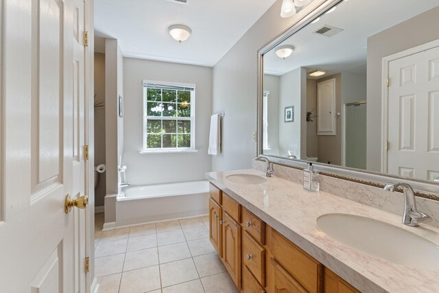7104 Elrod Rd, Fairview, TN 37062 - bathroom with double vanity, tile patterned floors, and a bath