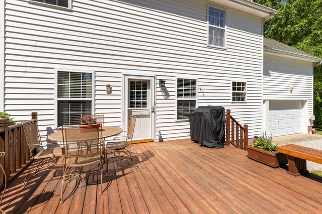 7104 Elrod Rd, Fairview, TN 37062 - deck featuring area for grilling, outdoor dining space, and an attached garage