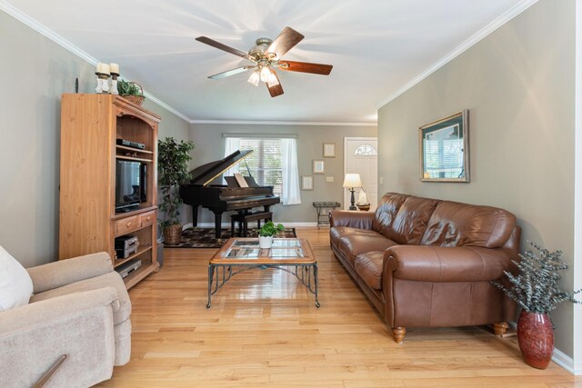 7104 Elrod Rd, Fairview, TN 37062 - living room featuring a ceiling fan, light wood-style flooring, crown molding, and baseboards