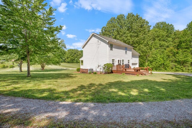 7104 Elrod Rd, Fairview, TN 37062 - view of home's exterior with a deck and a yard