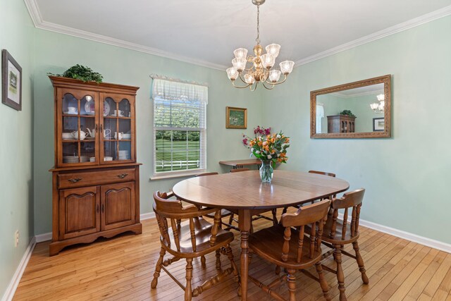 7104 Elrod Rd, Fairview, TN 37062 - dining area with light wood finished floors, ornamental molding, a chandelier, and baseboards