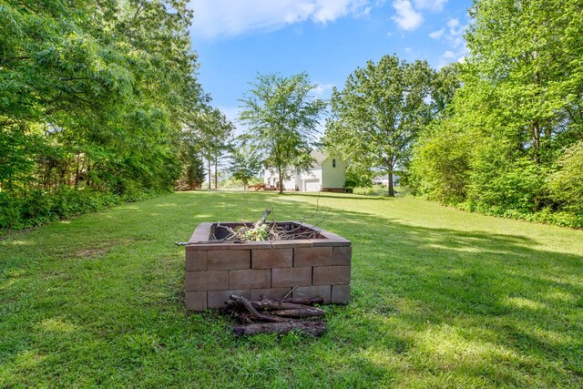 7104 Elrod Rd, Fairview, TN 37062 - view of grassy yard featuring a fire pit