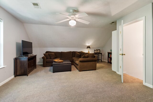 7104 Elrod Rd, Fairview, TN 37062 - living room featuring light carpet, vaulted ceiling, a ceiling fan, and baseboards