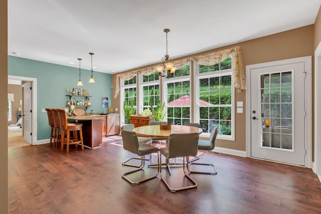 1764 Warren Hollow Rd, Nolensville, TN 37135 - dining area featuring dark wood-style floors, bar, recessed lighting, baseboards, and a chandelier
