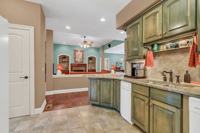 1764 Warren Hollow Rd, Nolensville, TN 37135 - kitchen featuring green cabinets, a fireplace, a sink, tasteful backsplash, and a ceiling fan