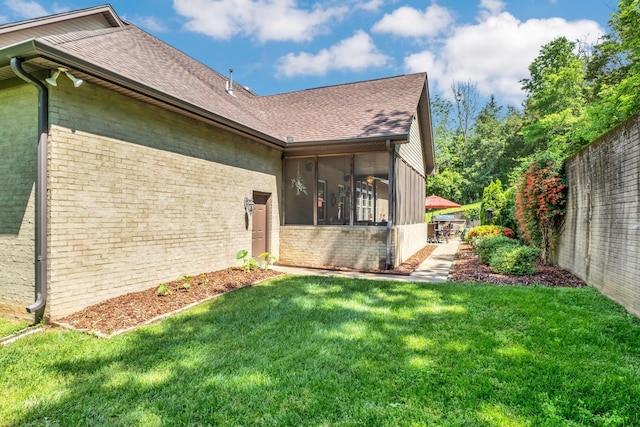 1764 Warren Hollow Rd, Nolensville, TN 37135 - view of side of property with a sunroom, a shingled roof, and brick siding