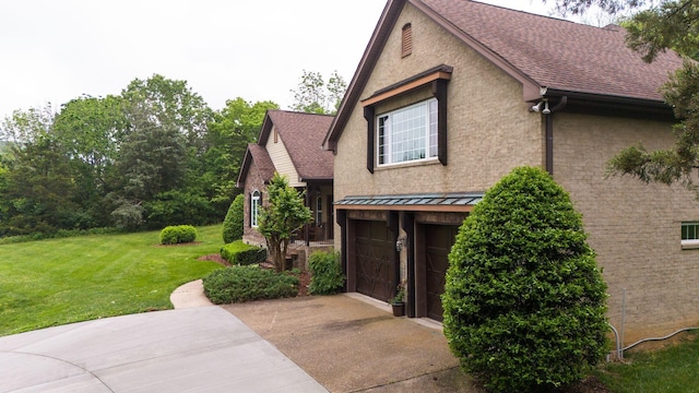 1764 Warren Hollow Rd, Nolensville, TN 37135 - view of home's exterior with a garage, a lawn, concrete driveway, and roof with shingles