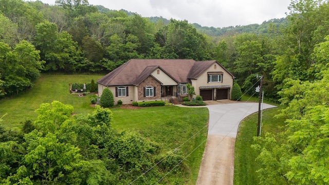 1764 Warren Hollow Rd, Nolensville, TN 37135 - view of front facade featuring a garage, a wooded view, a front lawn, concrete driveway, and brick siding