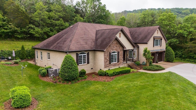 1764 Warren Hollow Rd, Nolensville, TN 37135 - view of front of house with an attached garage, concrete driveway, stucco siding, cooling unit, and a front yard