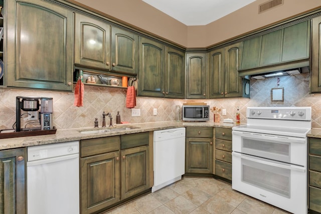 1764 Warren Hollow Rd, Nolensville, TN 37135 - kitchen with white appliances, green cabinets, a sink, and tasteful backsplash