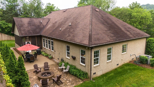 1764 Warren Hollow Rd, Nolensville, TN 37135 - rear view of property with crawl space, a fire pit, roof with shingles, a patio area, and a yard