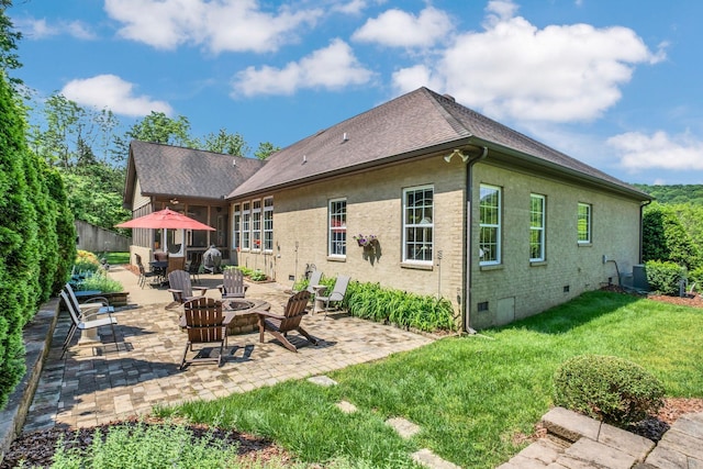 1764 Warren Hollow Rd, Nolensville, TN 37135 - rear view of house with crawl space, a patio area, a shingled roof, and an outdoor fire pit
