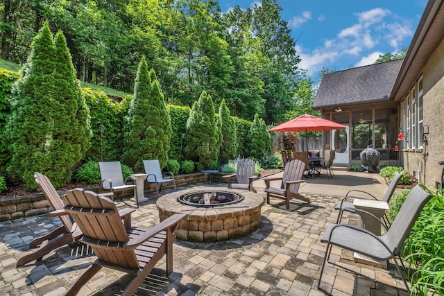 1764 Warren Hollow Rd, Nolensville, TN 37135 - view of patio featuring a fire pit, a sunroom, and outdoor dining area