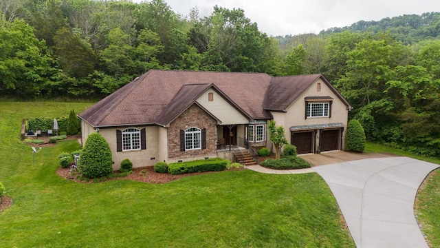 1764 Warren Hollow Rd, Nolensville, TN 37135 - view of front facade with concrete driveway, a view of trees, an attached garage, and a front yard