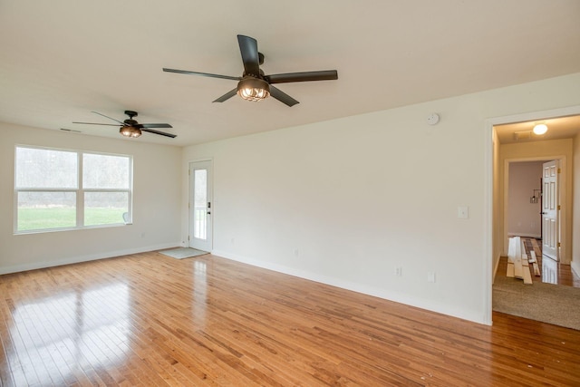 8310 Dog Creek Rd, Primm Springs, TN 38476 - empty room with light wood-style flooring, a ceiling fan, and baseboards