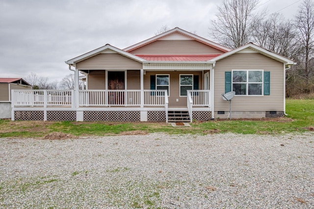 8310 Dog Creek Rd, Primm Springs, TN 38476 - view of front facade with crawl space, metal roof, and covered porch