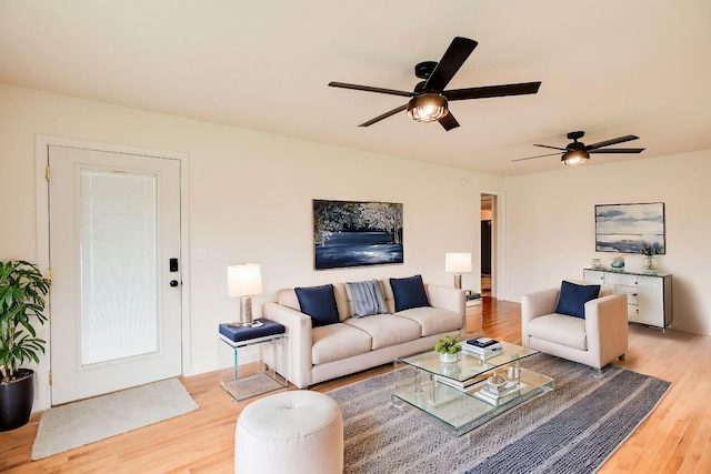 8310 Dog Creek Rd, Primm Springs, TN 38476 - living room with light wood finished floors and a ceiling fan