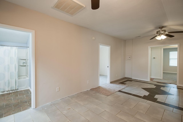 8310 Dog Creek Rd, Primm Springs, TN 38476 - empty room featuring a ceiling fan and light tile patterned floors