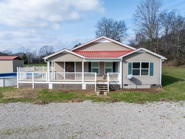 8310 Dog Creek Rd, Primm Springs, TN 38476 - view of front facade with crawl space, metal roof, an outdoor pool, and covered porch