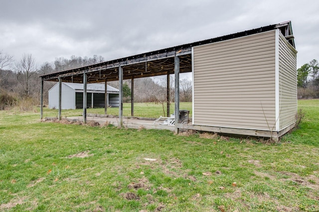 8310 Dog Creek Rd, Primm Springs, TN 38476 - view of pole building with a yard