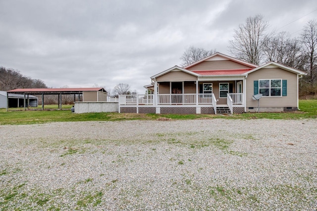 8310 Dog Creek Rd, Primm Springs, TN 38476 - view of front of property featuring crawl space, a porch, gravel driveway, and metal roof