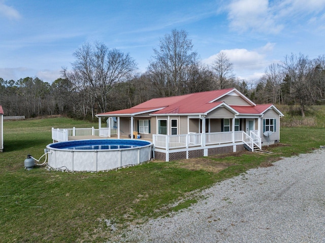 8310 Dog Creek Rd, Primm Springs, TN 38476 - exterior space featuring covered porch, an outdoor pool, a front lawn, metal roof, and crawl space