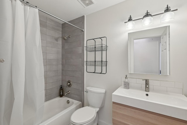 1423 Clairmonte Cir, Franklin, TN 37064 - bathroom with toilet, shower / bath combo with shower curtain, baseboards, and vanity