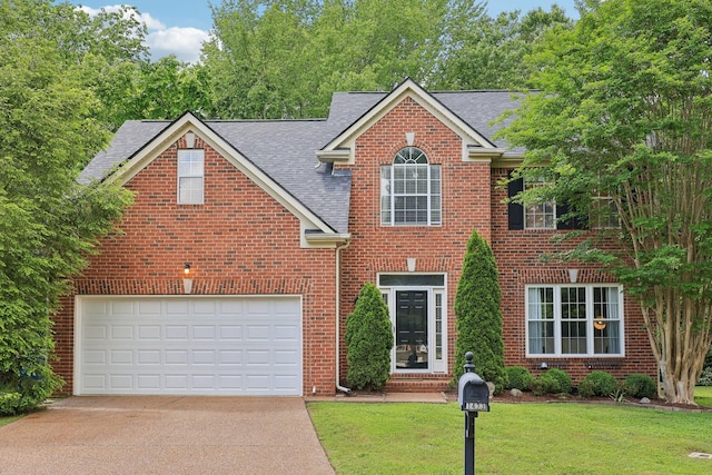 1423 Clairmonte Cir, Franklin, TN 37064 - traditional home with driveway, brick siding, roof with shingles, and a front yard
