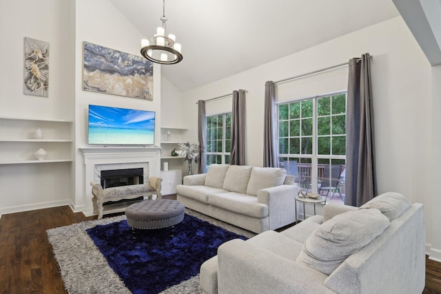 1423 Clairmonte Cir, Franklin, TN 37064 - living room with a chandelier, a high end fireplace, dark wood-style floors, high vaulted ceiling, and baseboards