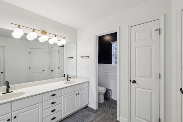 1423 Clairmonte Cir, Franklin, TN 37064 - bathroom featuring toilet, double vanity, and wood finished floors