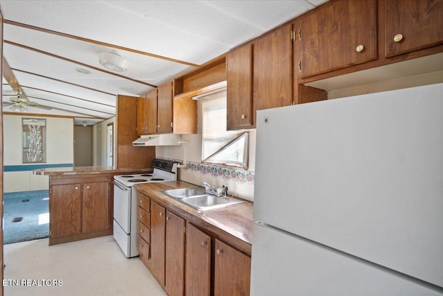 kitchen with white appliances, a sink, under cabinet range hood, brown cabinetry, and ceiling fan