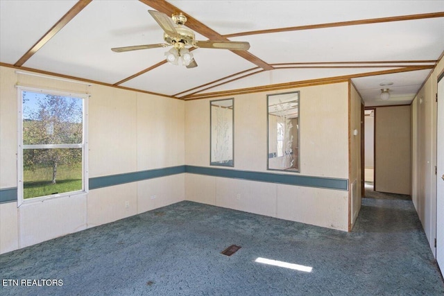 empty room with carpet, vaulted ceiling, and ceiling fan